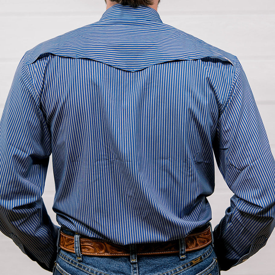 Person wearing a blue striped shirt and jeans from behind on a plain background. back facing. 