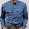 Man wearing a blue striped shirt with a belt and buckle against a plain background. front facing.
