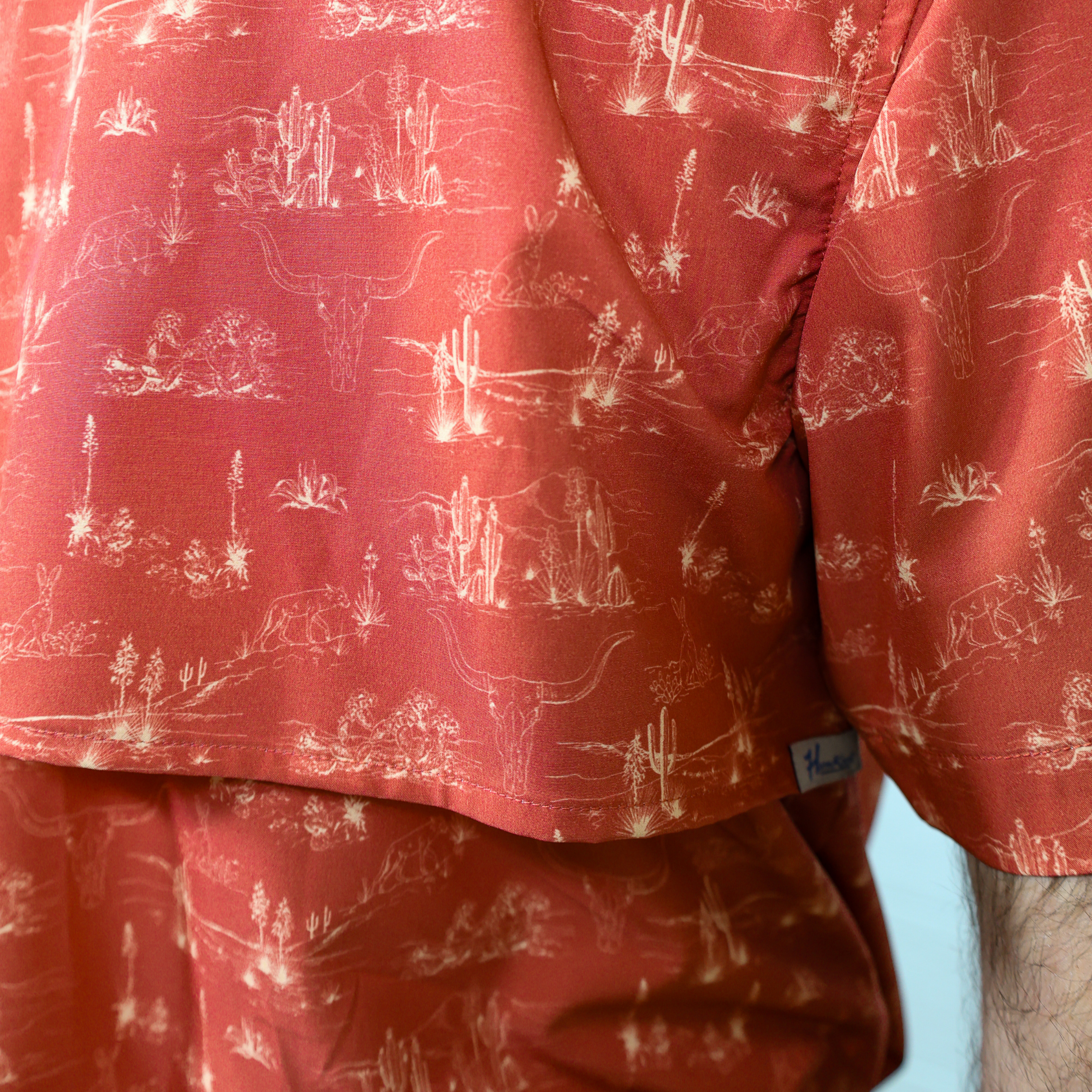 Red shirt showing the vent with white pattern on a plain background