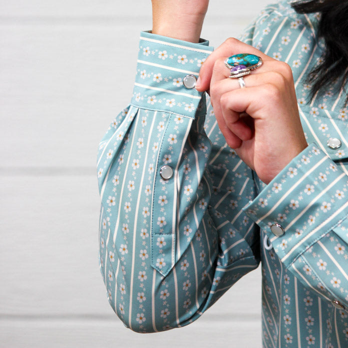 Up close of pearl snaps buttoning