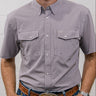 Purple short-sleeve shirt with pockets worn by a person against a white background