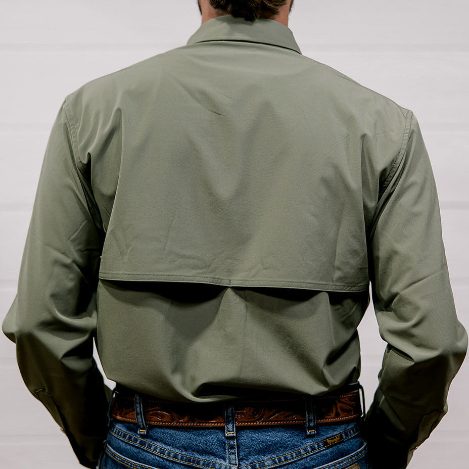 Person wearing a green shirt and blue jeans from behind on a white background. Back facing