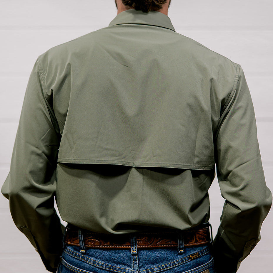 Person wearing a green shirt and blue jeans from behind on a white background. Back facing