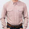 A man wearing a long-sleeve button-down western shirt with a fine red and white gingham pattern, paired with a brown leather belt and dark blue jeans against a white wood-paneled wall.