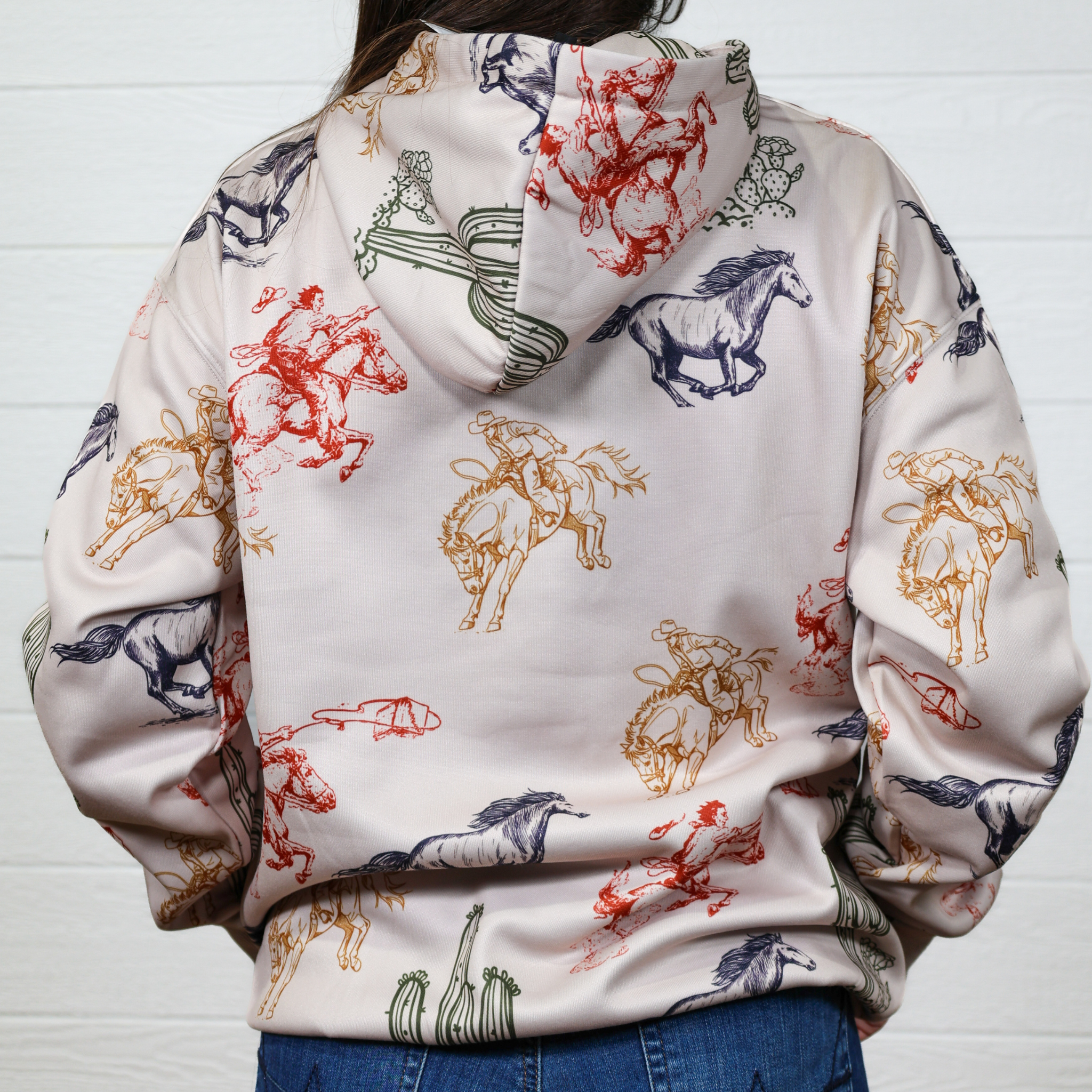 Hoodie with horse and rider pattern on a white background. Back facing