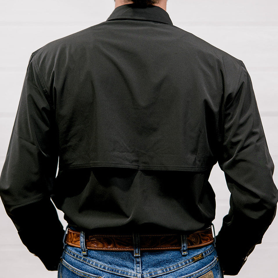 Man wearing a black shirt and blue jeans against a white background. back facing.