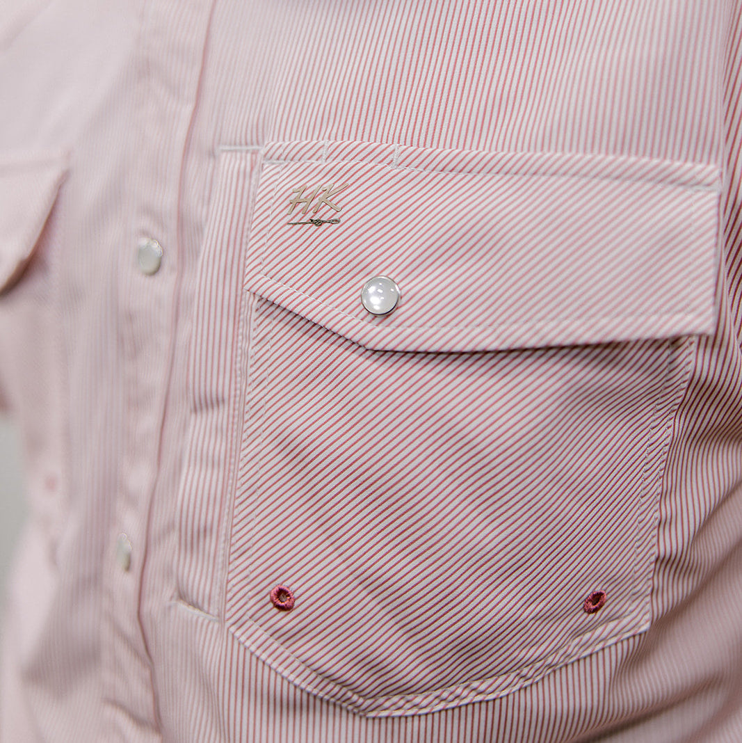 Close-up of a mauve striped shirt with button details on a plain background.