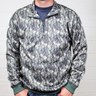 Person wearing a camouflage pullover with a white background showing the front