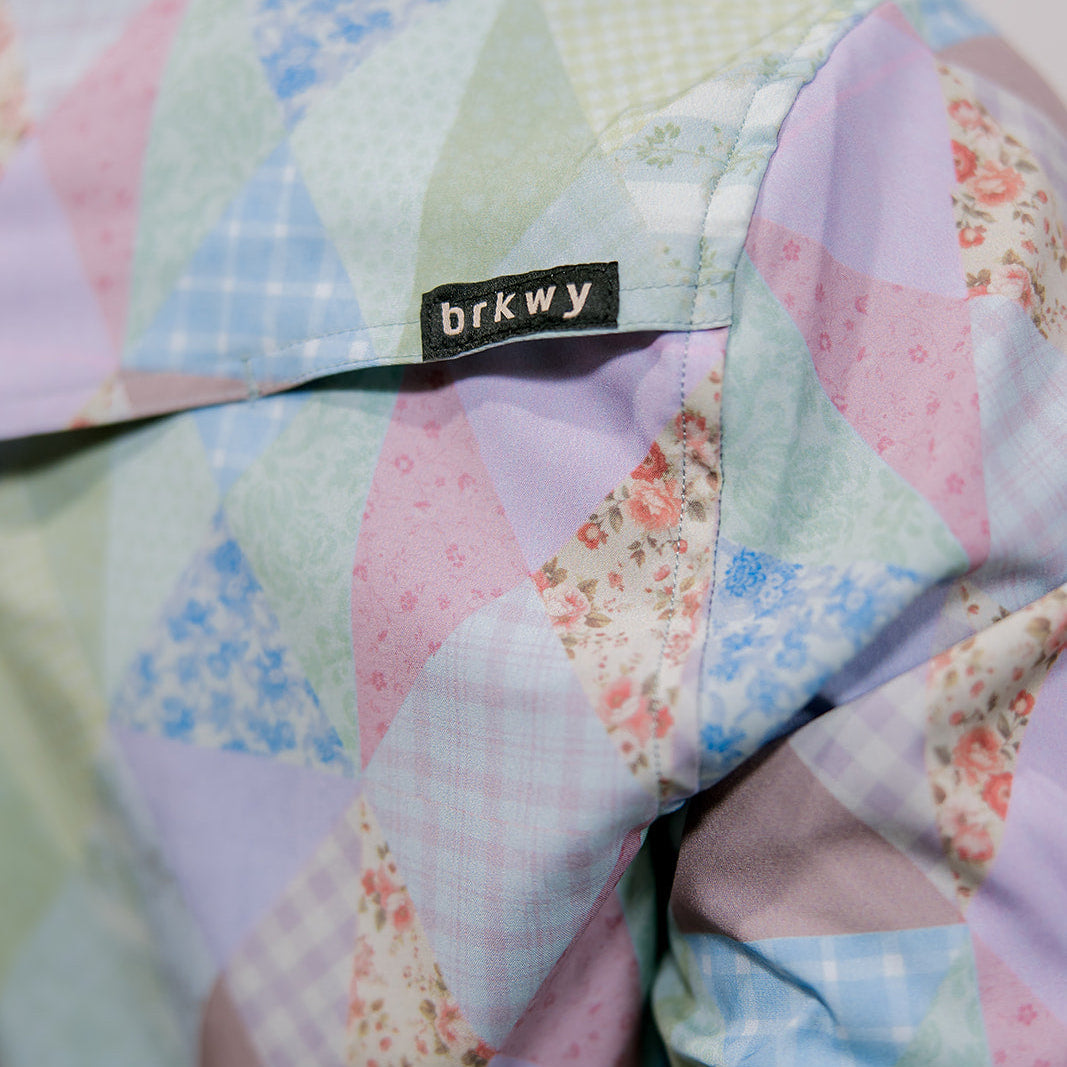 Pastel quilt with geometric pattern and 'brkwy' label