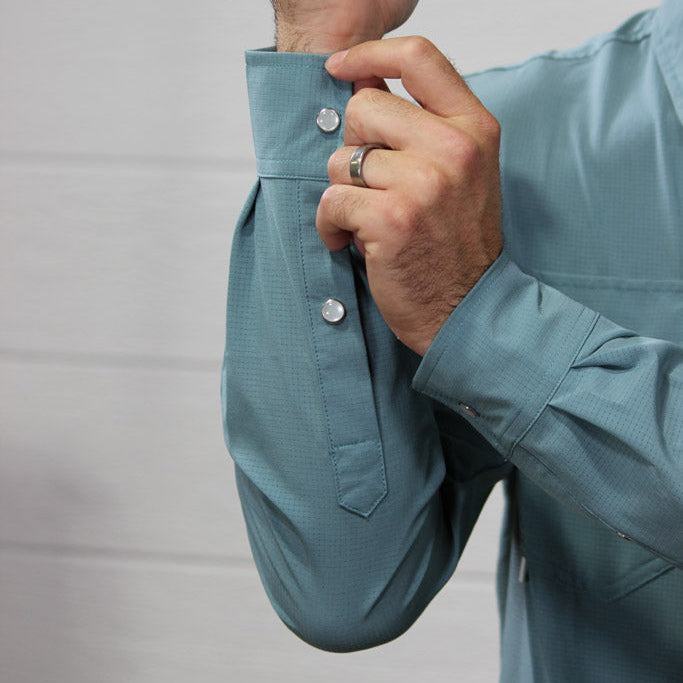 Up close of pearl snaps buttoning